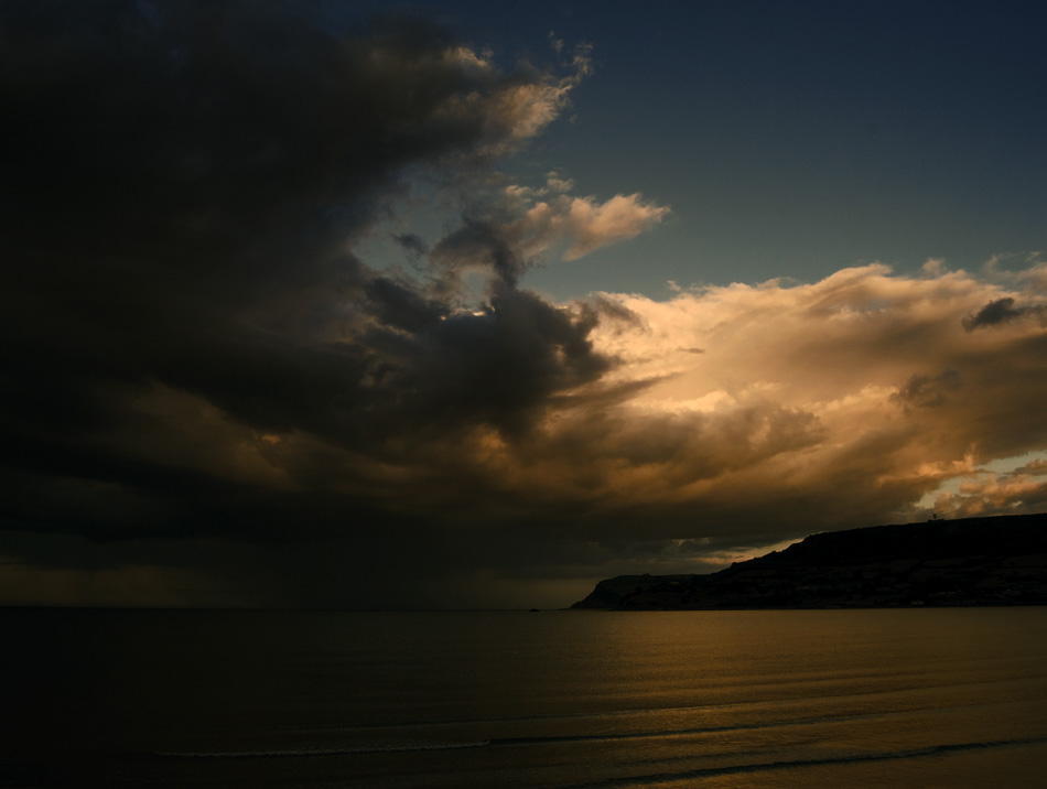 Landscape photograph of rain clouds over Irish Sea from Carnlough, Northern Ireland, by Stephen Bradley photographer - photograph 2546 photo icon.