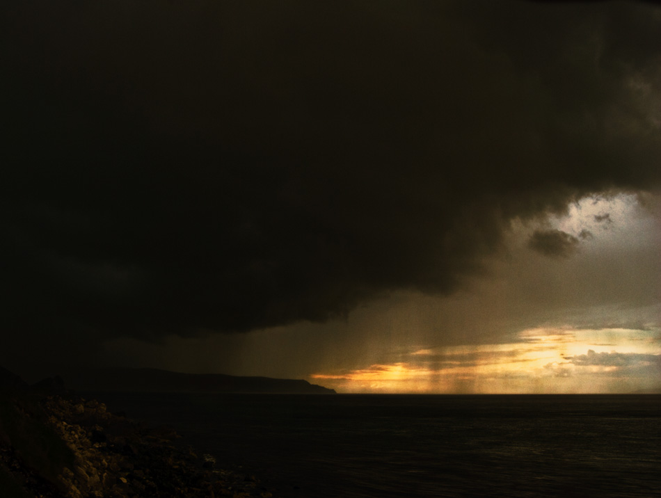 Clouds rolling onto Irish Sea from Glenariff, Northern Ireland - photo icon.