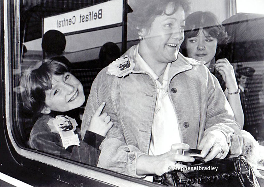 Mother and children on train going to see Pope John Paul, Central Station, Belfast, by Stephen S T Bradley, editorial, commercial, PR and advertising photographer, Dublin, Ireland