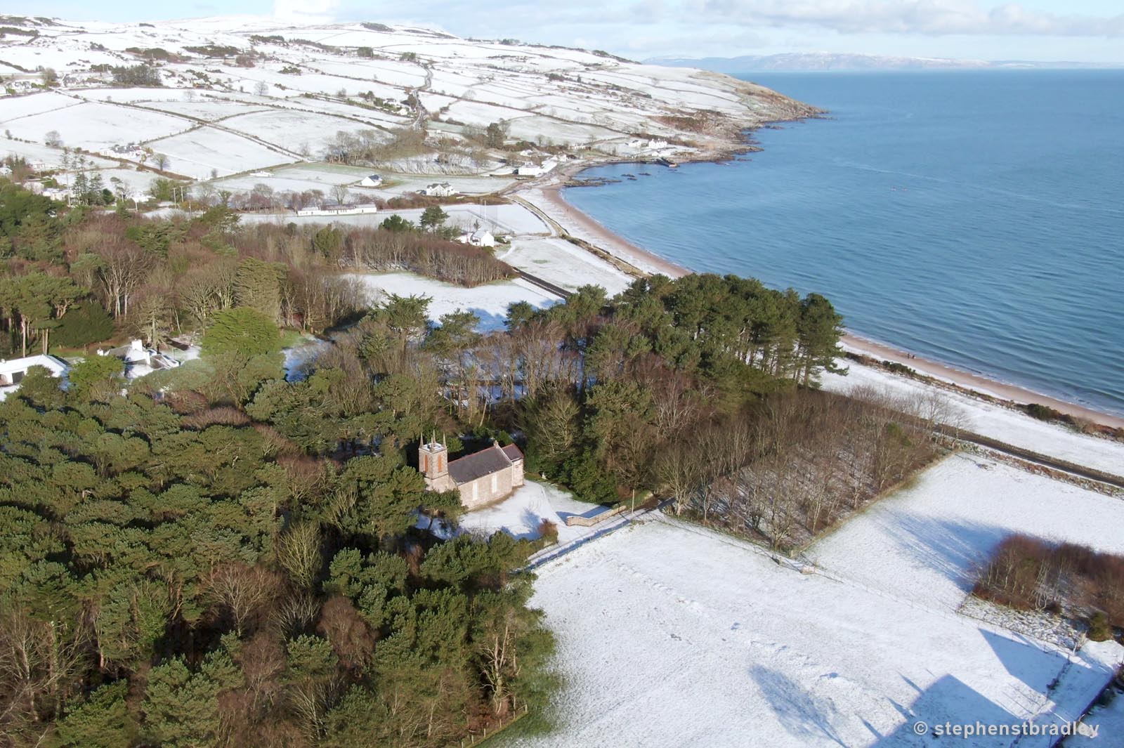 Aerial drone photography and video production services Dublin and Ireland portfolio - Cushendun village under snow in winter, video screenshot 2