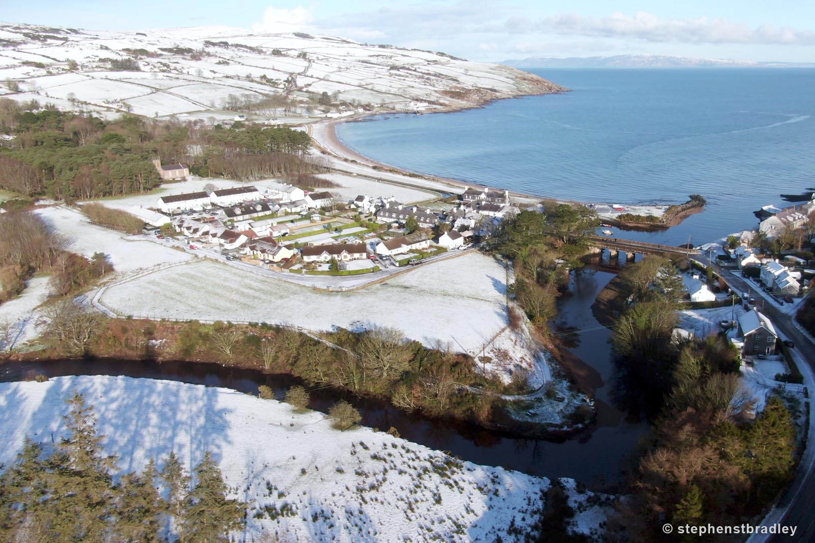 Aerial drone photography and video production services Dublin and Ireland portfolio - Cushendun village under snow in winter, video screenshot 3