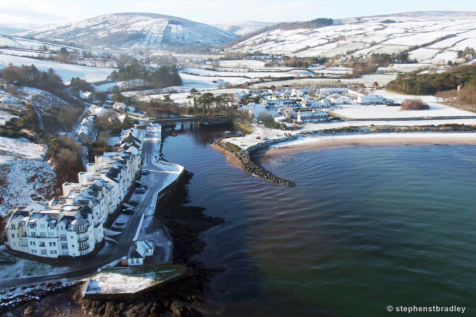 Aerial drone photography and video production services Dublin and Ireland portfolio - Cushendun village under snow in winter, video screenshot 5
