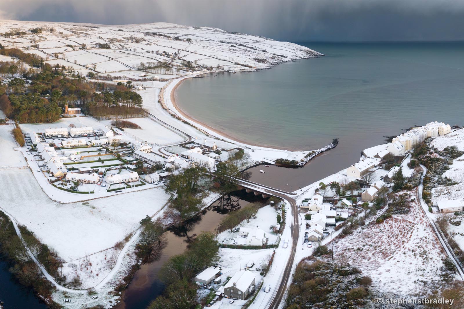 Aerial drone photography and video production services Dublin and Ireland portfolio - Cushendun village under snow in winter, video screenshot 6